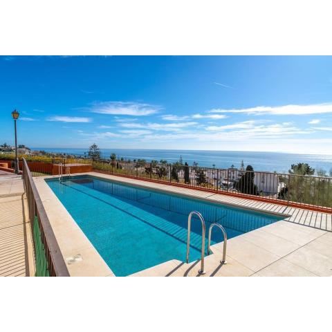 Adosado con vistas al mar desde la piscina con BBQ