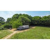 American School Bus Retreat with Hot Tub in Sussex Meadow