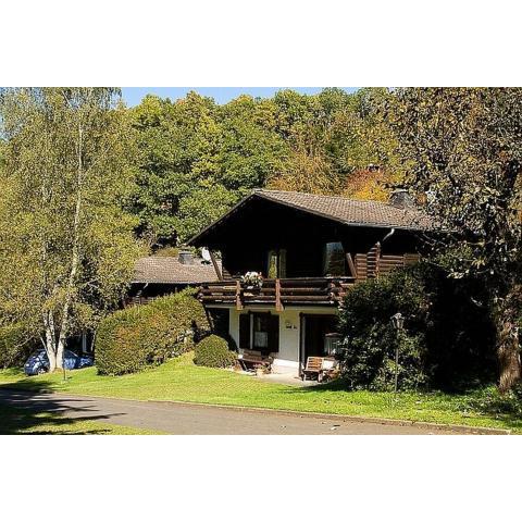 Cozy chalet with fireplace located in wooded area