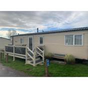 Gold Plus 6 Berth Caravan in NEW BEACH with parking WiFi and decking