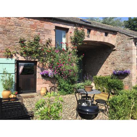 Historic converted byre in courtyard of 16C house