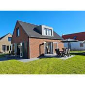 Modern holiday home with a nice terrace, in a holiday park near the North Sea