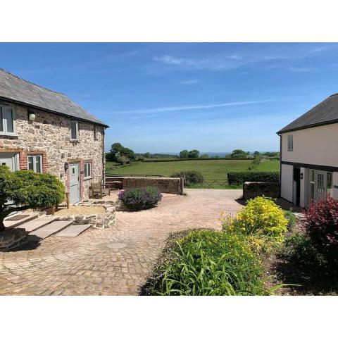 The Granary at Pentregaer Ucha, tennis court & lake.