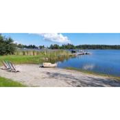 Timber house with private beach and boat including.